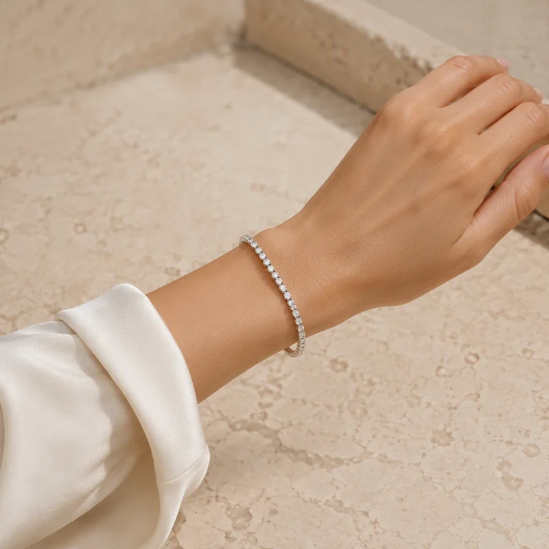 Diamond tennis bracelet worn on a wrist